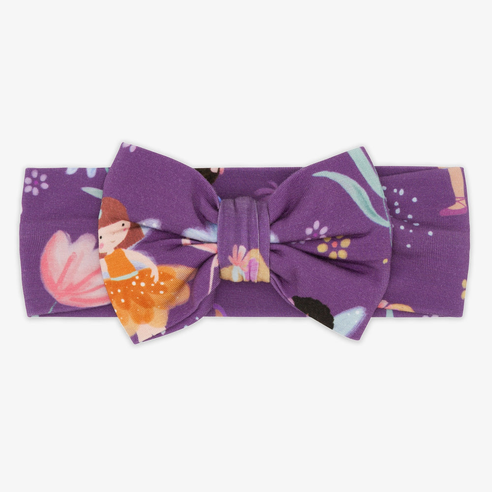 Flat lay image of the Garden Fairies Infant Luxe Bow Headband