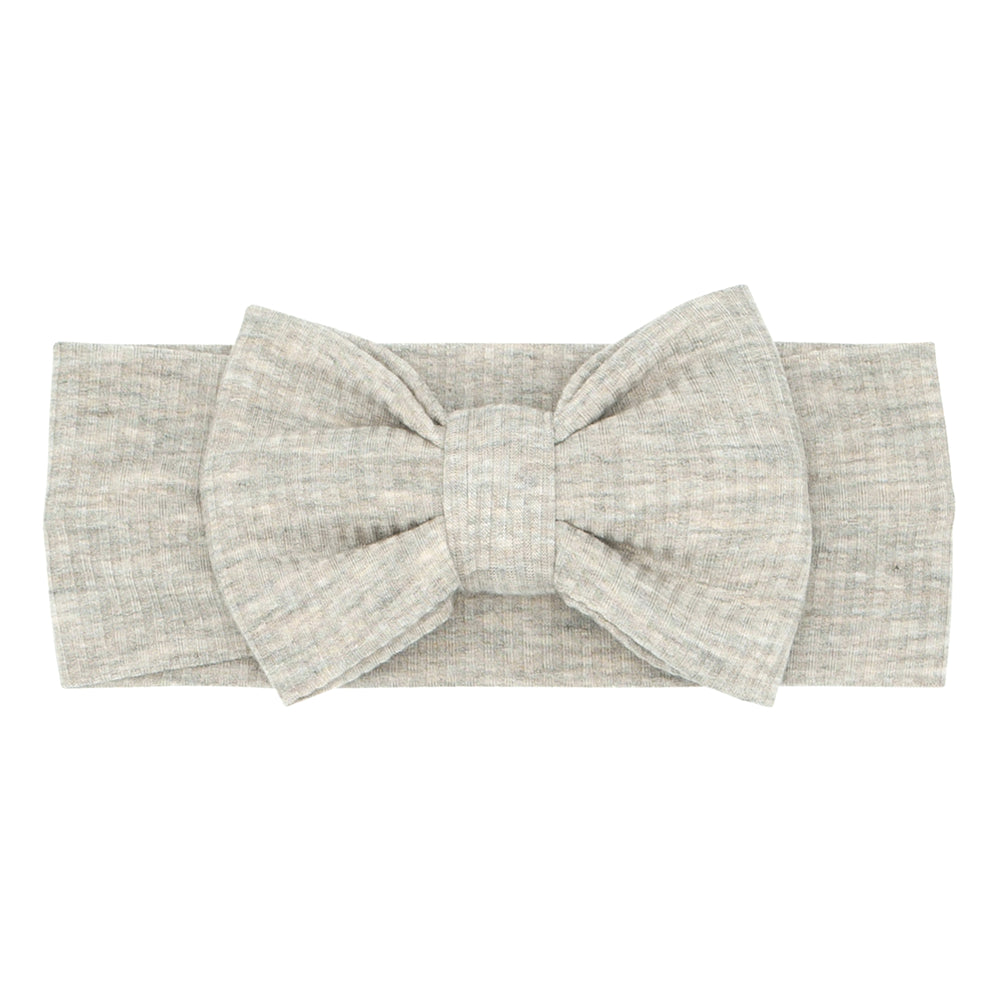 Click to see full screen - Flat lay image of a Heather Stone Ribbed luxe bow headband