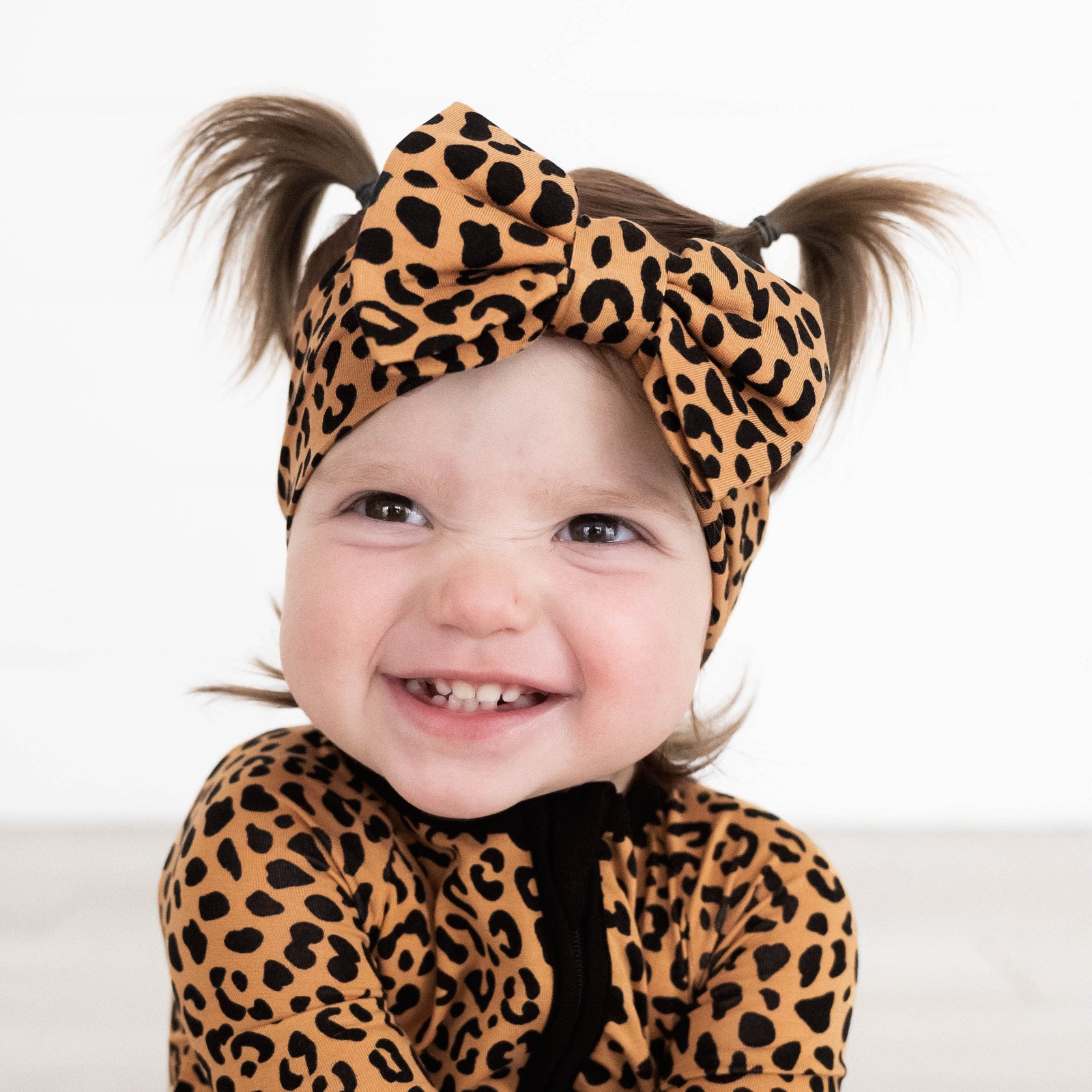 Girl wearing the Classic Leopard Luxe Bow Headband