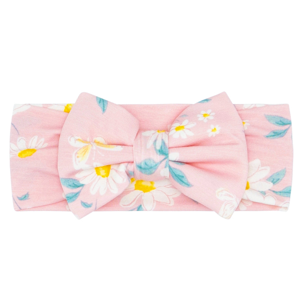 Click to see full screen - Flat lay image of a Rosy Meadow luxe bow headband