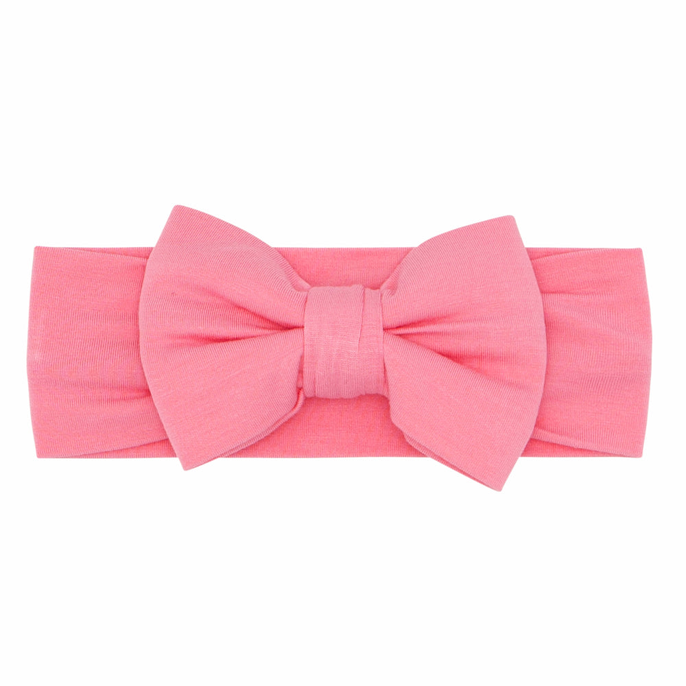 Flat lay image of a Sweet Pink luxe bow headband