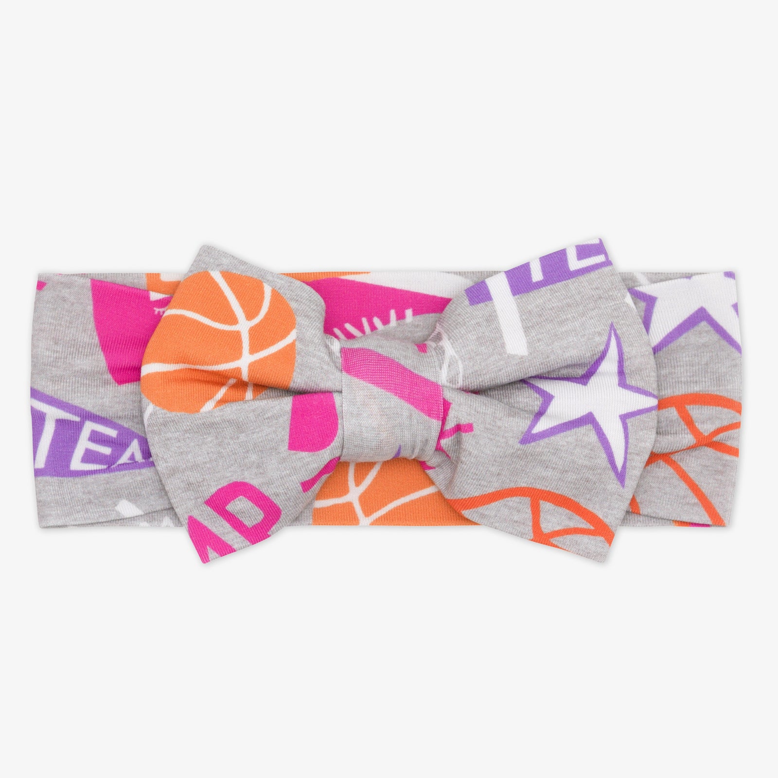 Flat lay of the Pink Slam Dunk Luxe bow headband