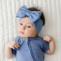 Close up image of a Slate Blue luxe bow headband