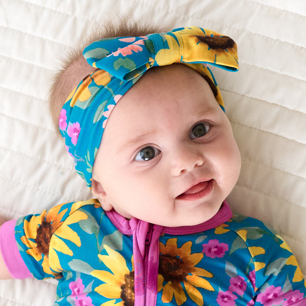 Close up image of baby wearing the Sunflower Fields Luxe Bow Headband