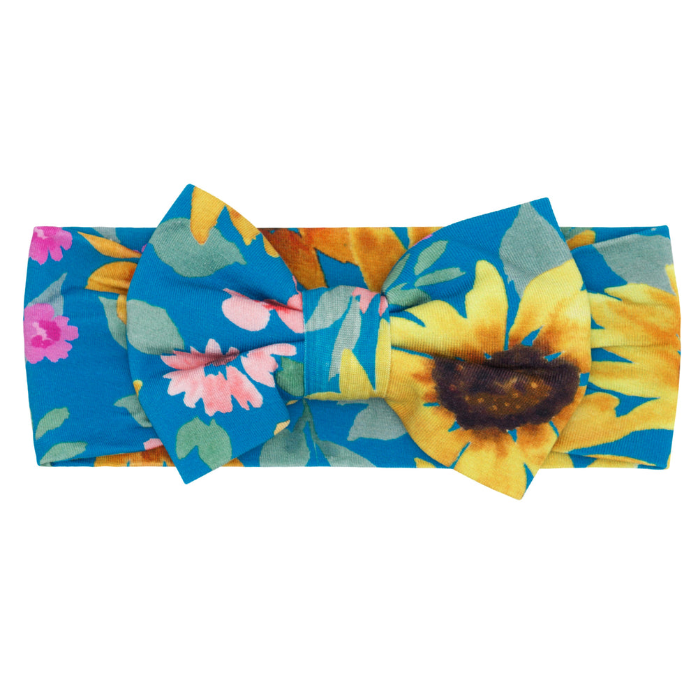 Flat lay image of the Sunflower Fields Luxe Bow Headband