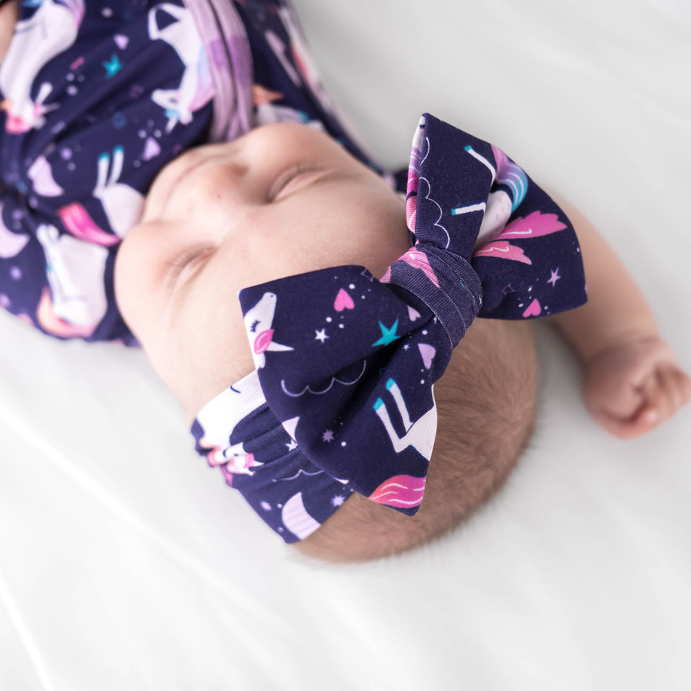 Baby wearing the Magical Skies Luxe Bow Headband