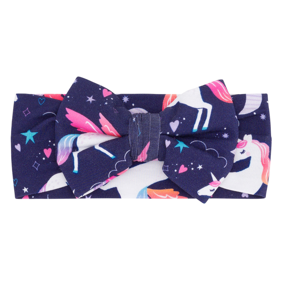 Flat lay image of the Magical Skies Luxe Bow Headband