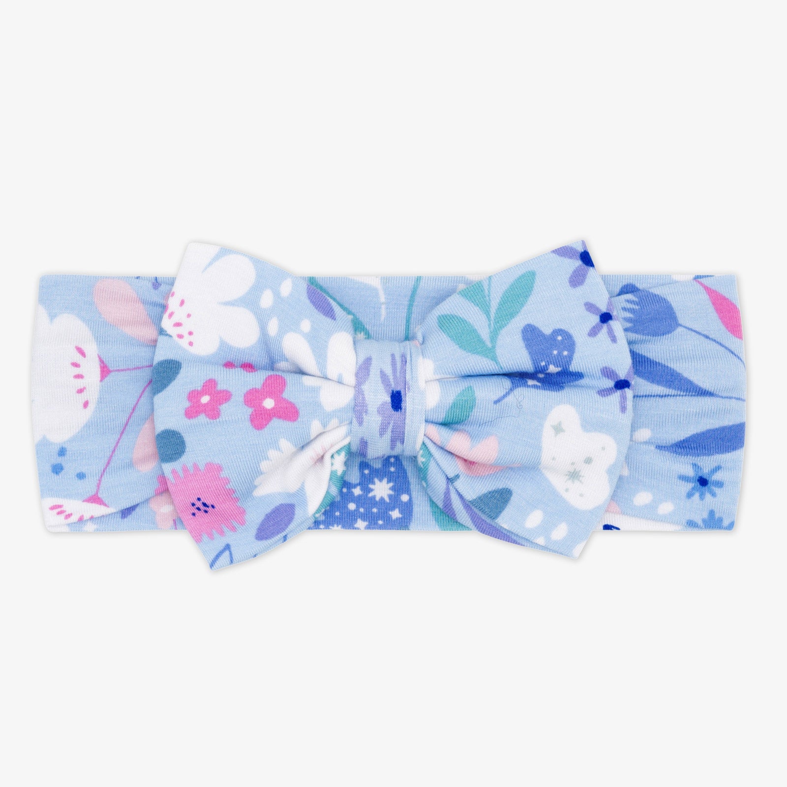 Flat lay image of a Magical Meadow luxe bow headband