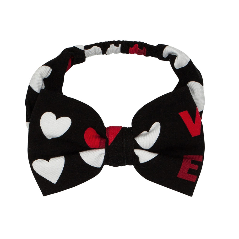 Click to see full screen - Flat lay image of Black XOXO luxe bow headband in size age 4 to age 8