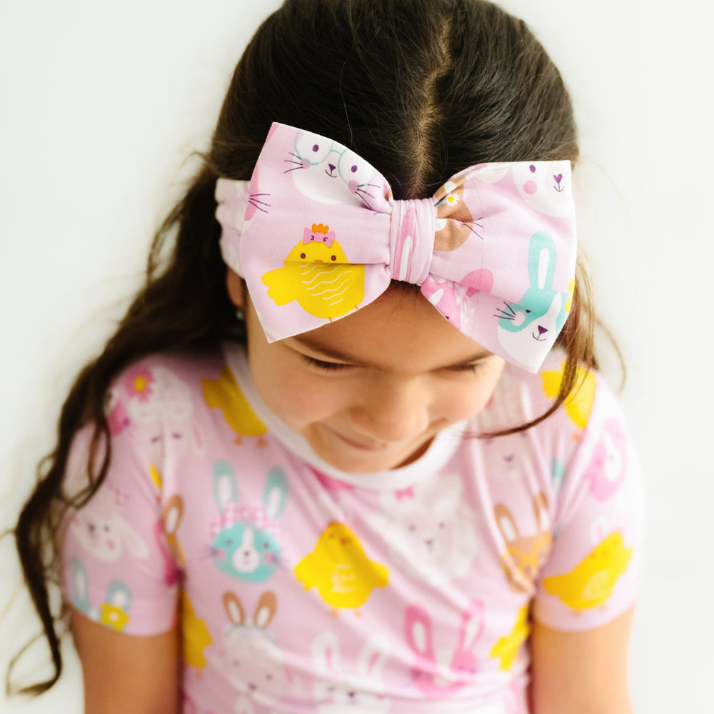 image of a child wearing a Pink Pastel Parade luxe bow headband