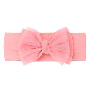 Flat lay image of a Pink tulle luxe bow headband