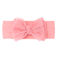 Flat lay image of a Pink tulle luxe bow headband