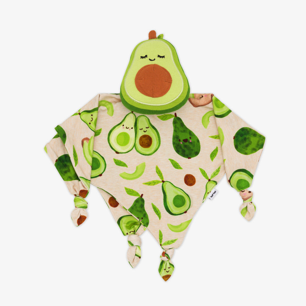 Flat lay image of Guac the Avocado sleepyhead lovey