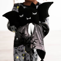 Close up image of child holding Benny the Bat Sleepyhead Lovey