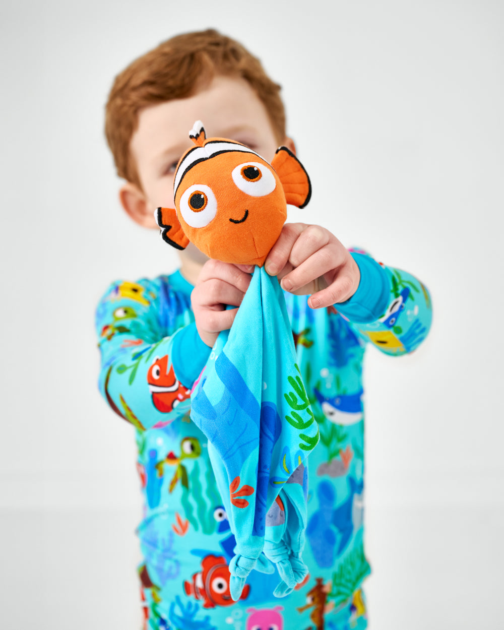 Child holding up the Disney Nemo Lovey