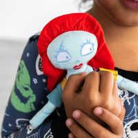 Alternative close up image of child holding the Disney Sally Lovey