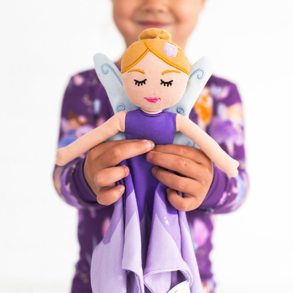 Close up image of child holding the Fiona the Purple Fairy Sleepyhead Lovey