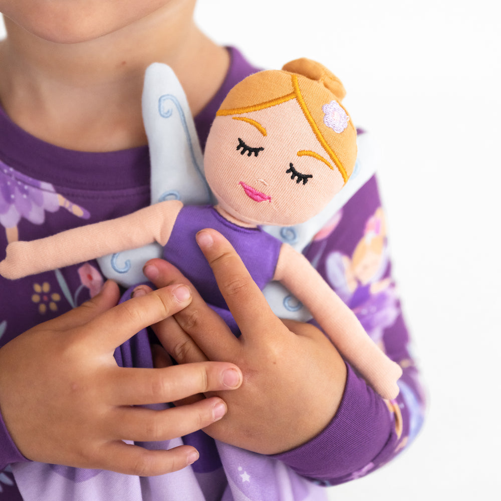 Alternative close up image of child holding then Fiona the Purple Fairy Sleepyhead Lovey