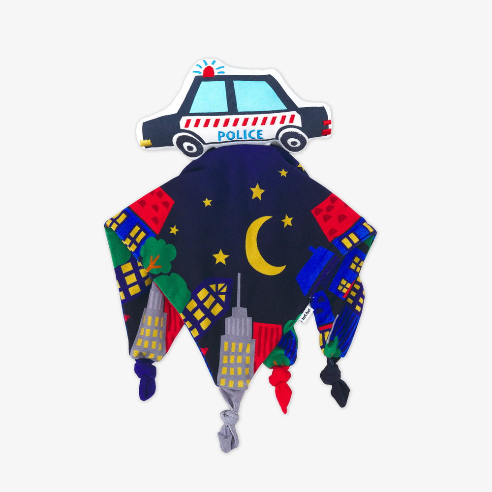 Flat lay image of a Polly the Police Car sleepyhead lovey