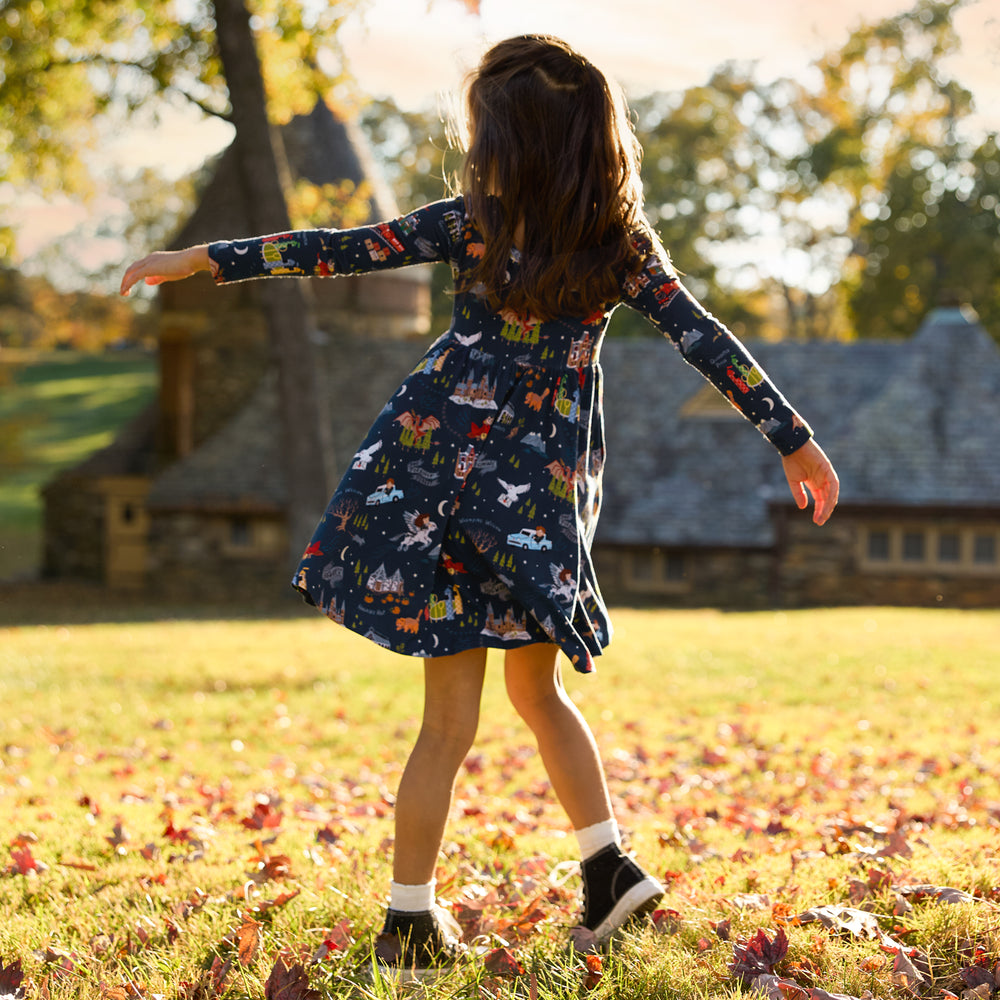 Image of a child outdoors wearing an Evening at Hogwarts Twirl Dress