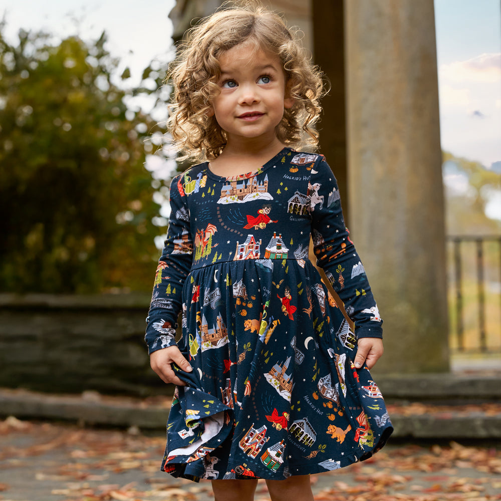 Image of a child outdoors wearing an Evening at Hogwarts Twirl Dress With Bodysuit