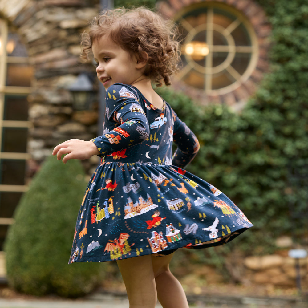 Image of a child outdoors spinning around wearing an Evening at Hogwarts Twirl Dress With Bodysuit