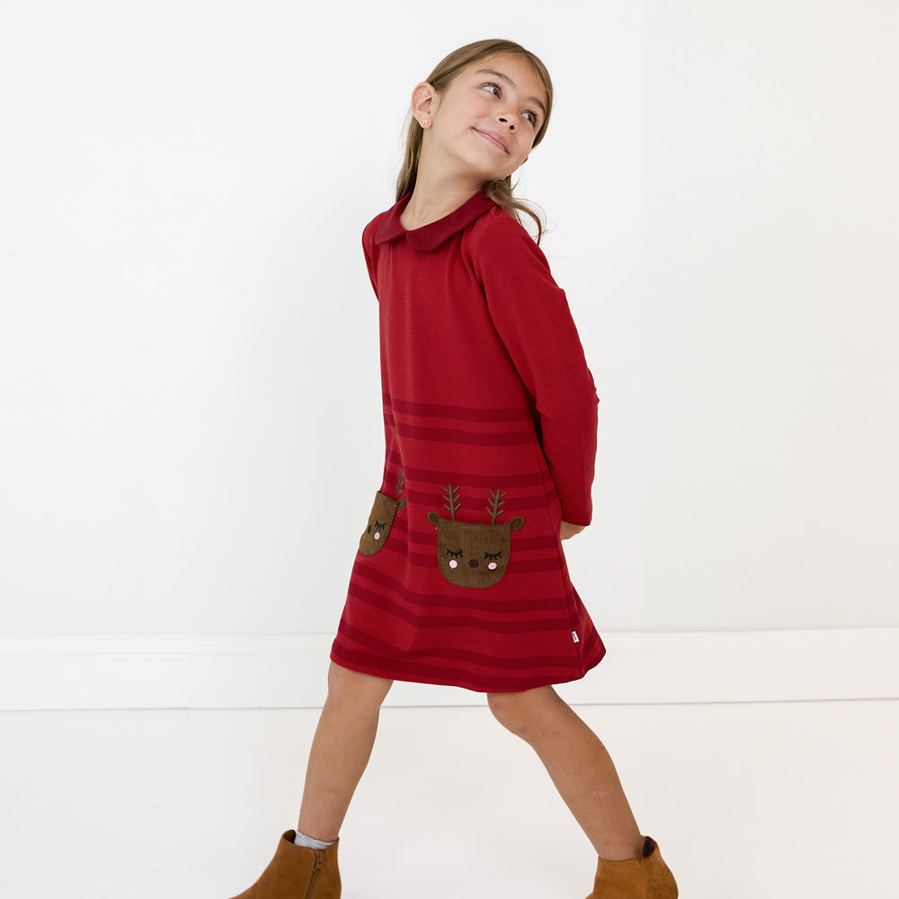 Child wearing a Holiday Red Collar Pocket Dress