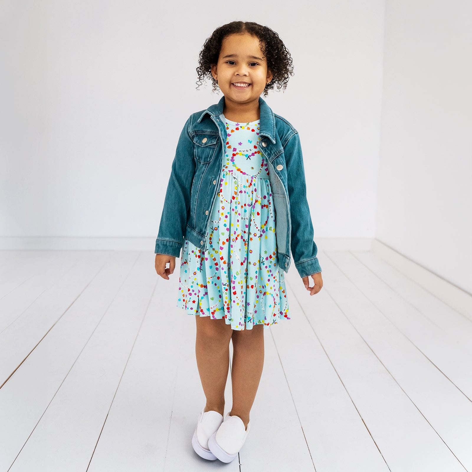 child wearing a friends forever twirl dress and midwash blue denim trucker jacket