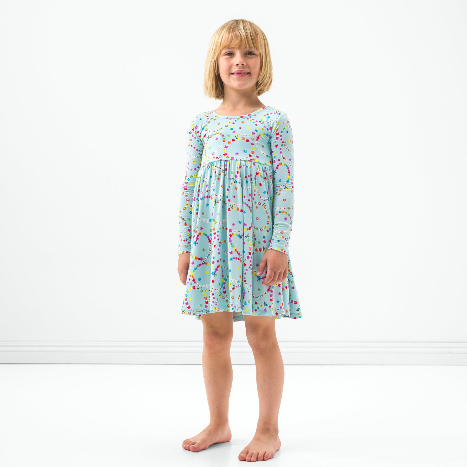 Standing child wearing the Friends Forever twirl dress