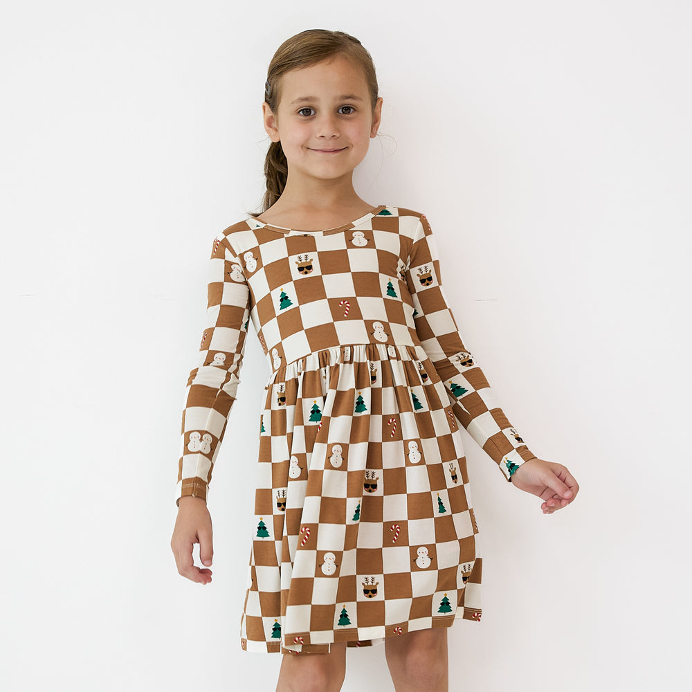 Child wearing a Holiday Checks Skater Dress