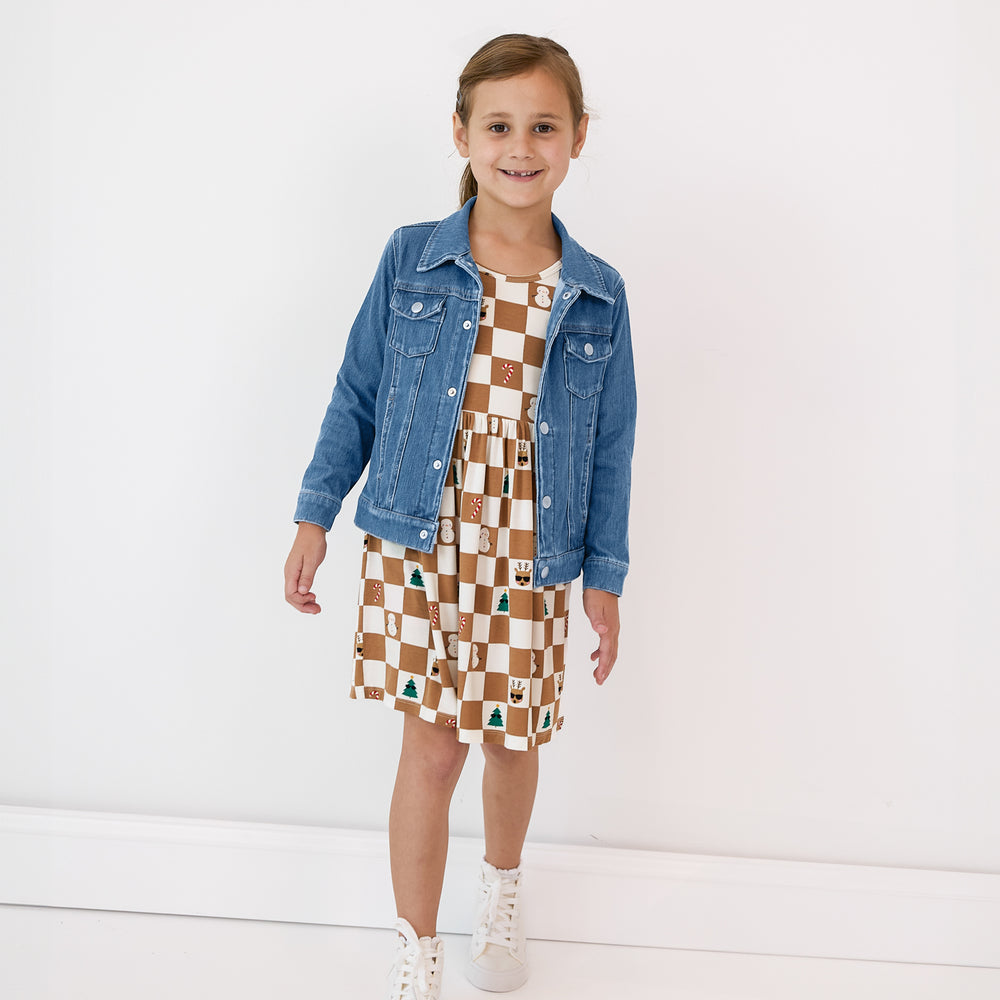 Child wearing a Holiday Checks Skater Dress and Midwash Blue Denim Trucker Jacket