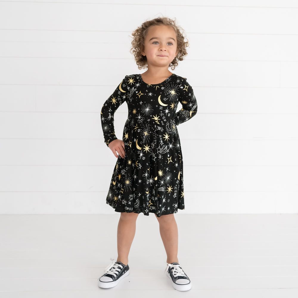 Image of a girl wearing a Celebration Stars Twirl Dress