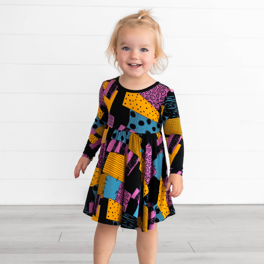 Girl wearing the Disney Sally's Patchwork Twirl Dress