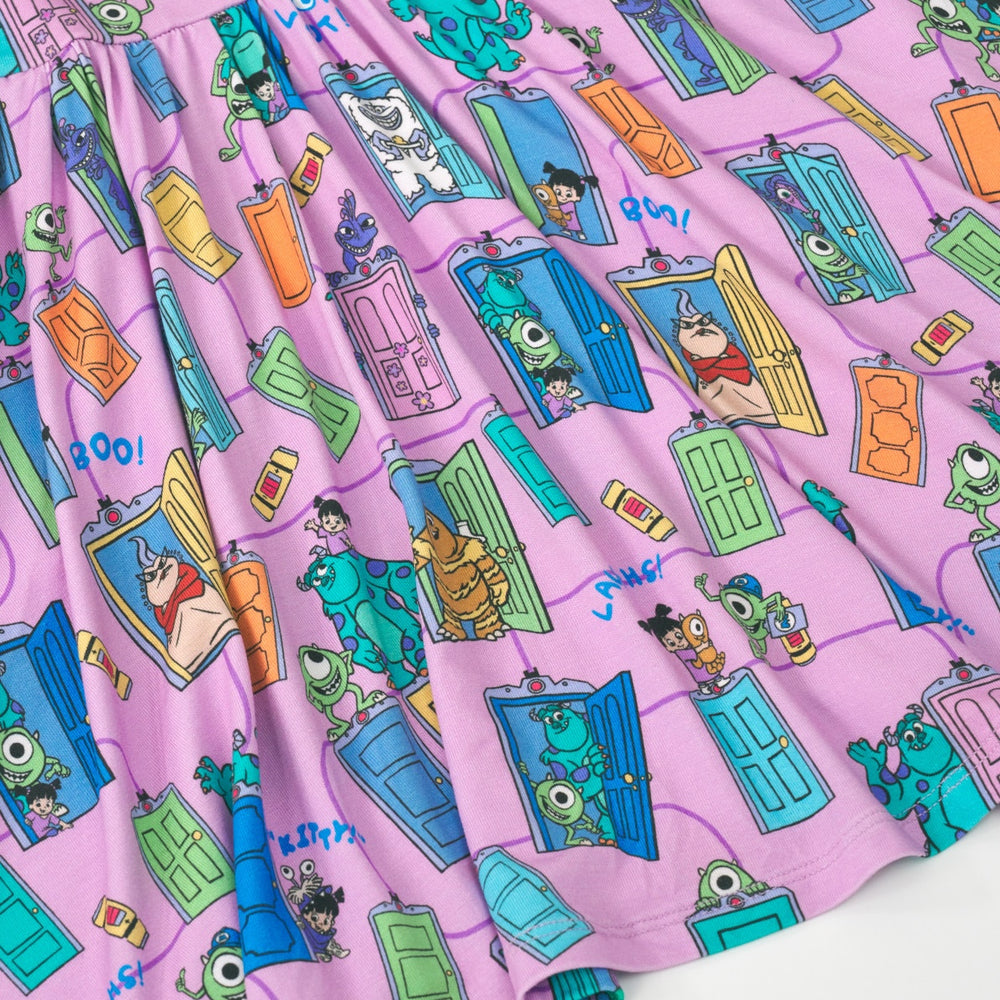 Close up image of the graphic details on the Disney Monsters, Inc. Scream Team Twirl Dress