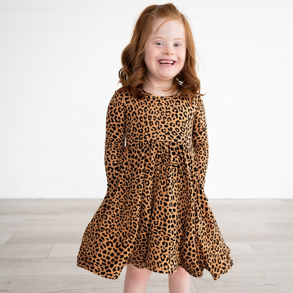 Girl wearing the Classic Leopard Twirl Dress