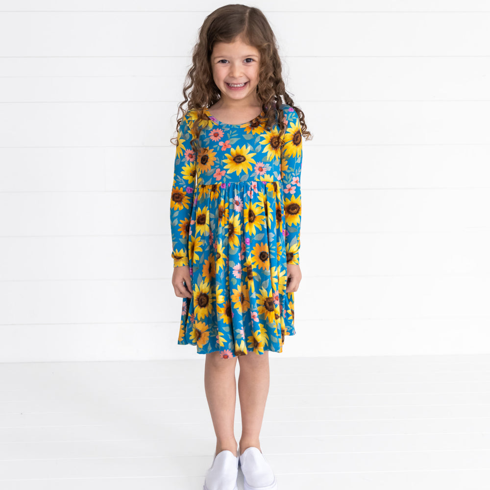 Image of a child wearing a Sunflower Fields Twirl Dress