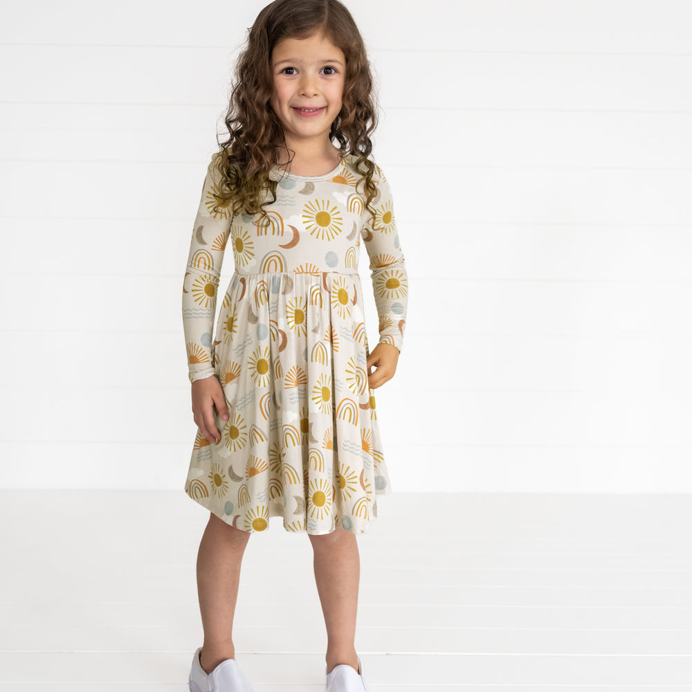 Image of a child wearing a Desert Sunrise Twirl Dress