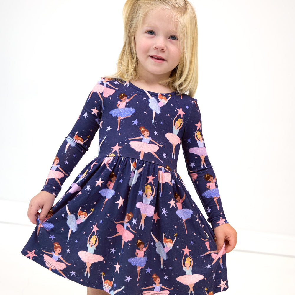 Girl posing in the Twilight Ballet Bow Back Skater Dress