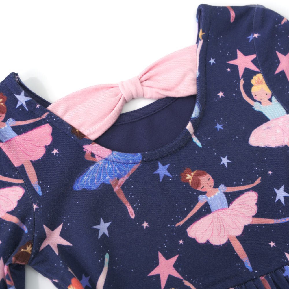 Close up image of the hemline and bow backing on a Twilight Ballet Bow Back Skater Dress