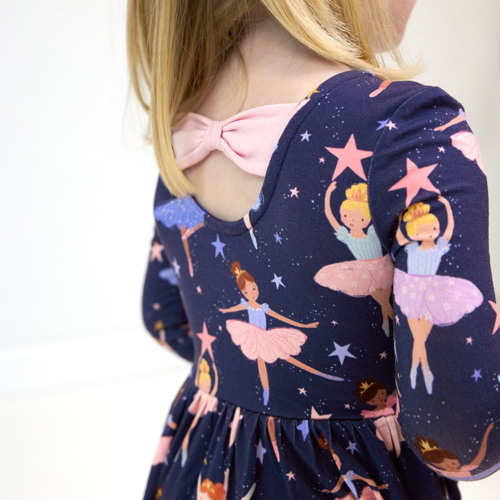 Close up image of the back detail on the Twilight Ballet Bow Back Skater Dress with Bodysuit