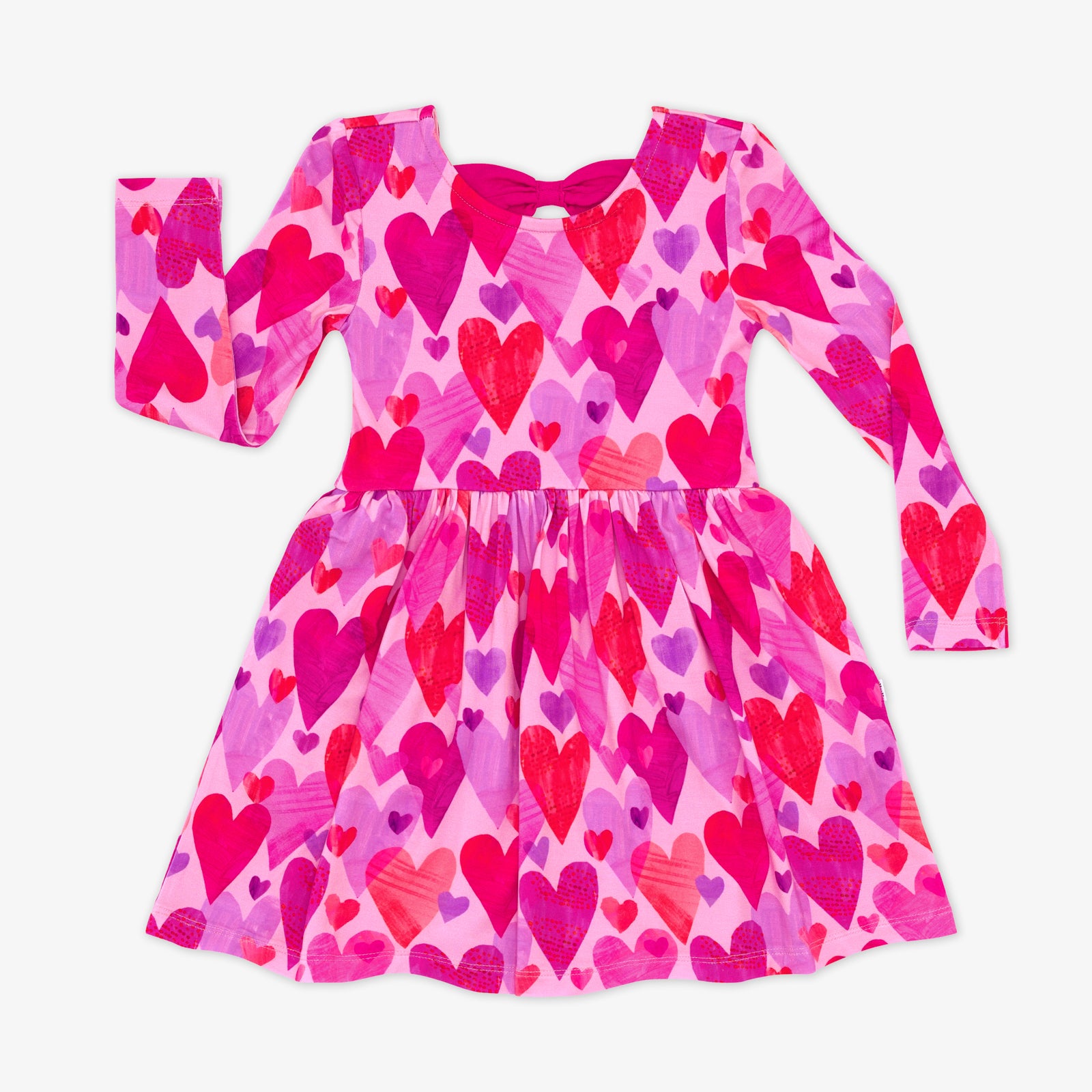 Flat lay of a long sleeve Pink Hearts & Crafts Bow Back Skater Dress