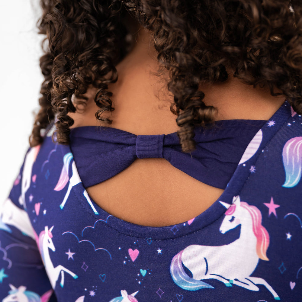Close up image of the back detail on the Magical Skies Bow Back Skater Dress