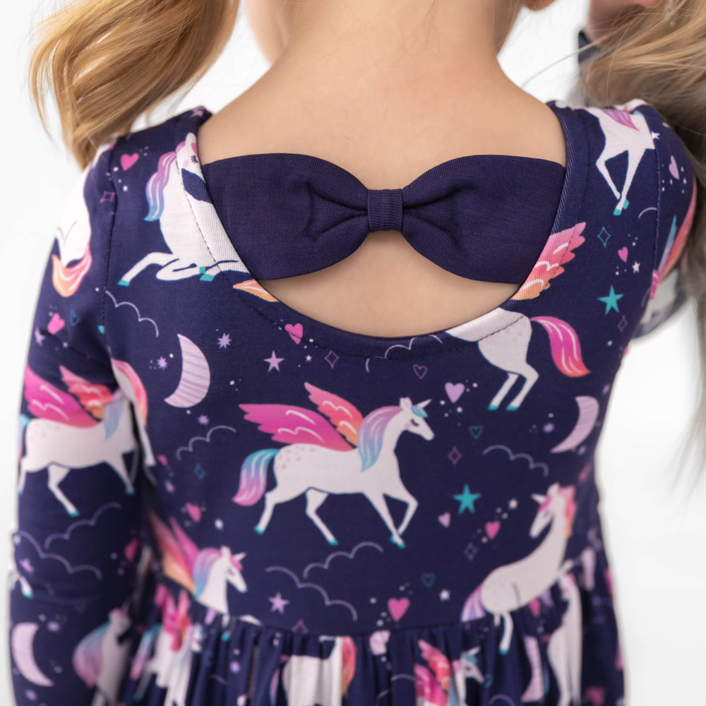 Close up image of the back detail on the Magical Skies Bow Back Skater Dress with Bodysuit