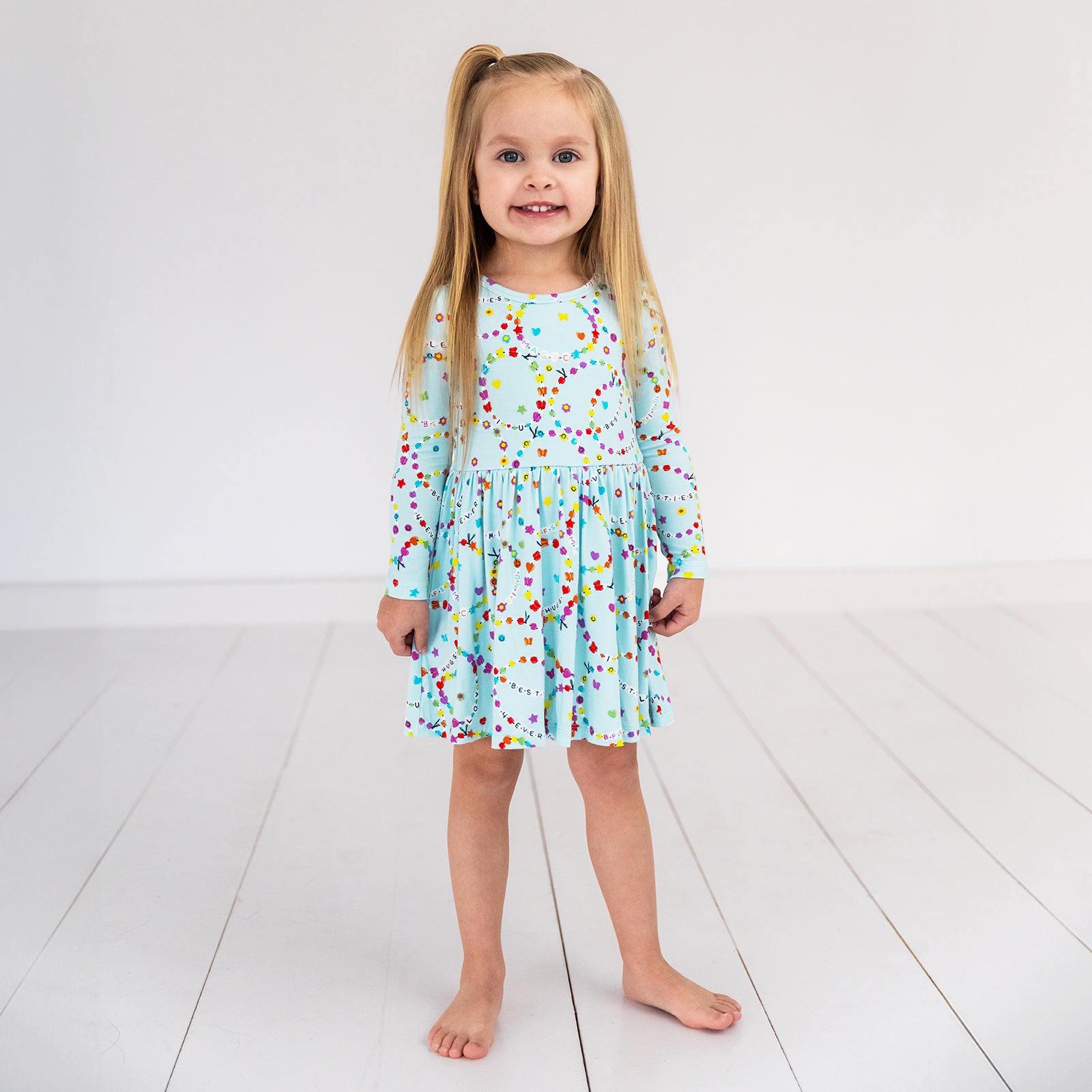 child wearing a friends forever twirl dress with bodysuit