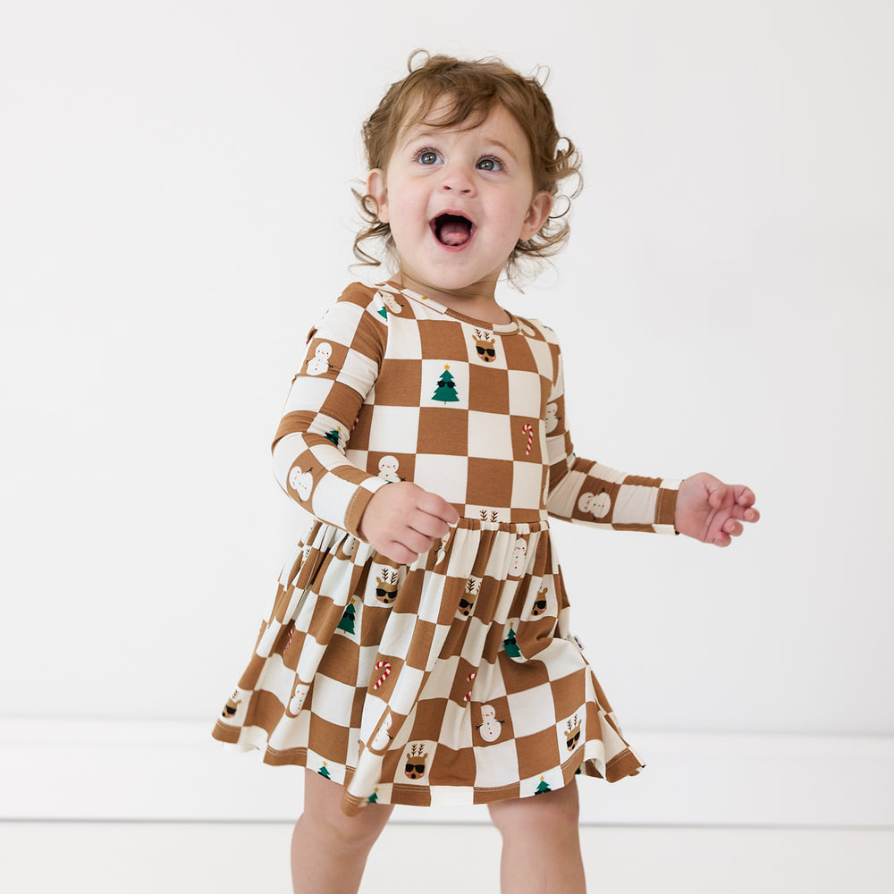 Child wearing a Holiday Checks Skater Dress with Bodysuit