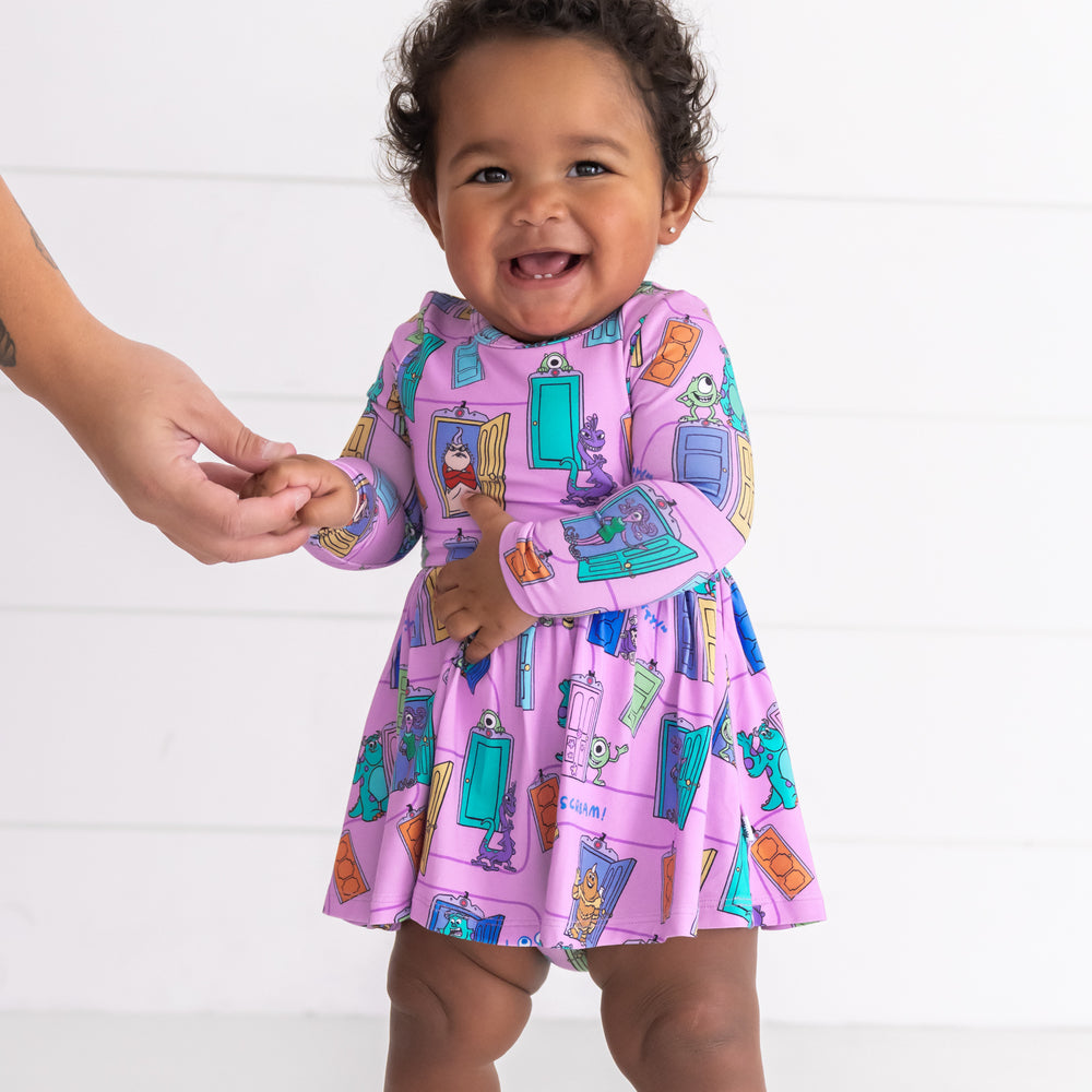 Alternative image of smiling baby girl wearing the Disney Monsters, Inc. Scream Team Twirl Dress with Bodysuit