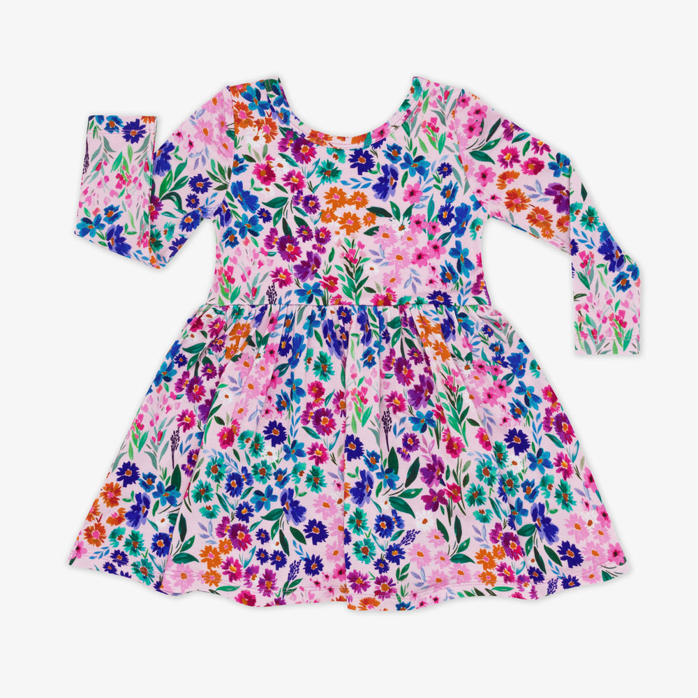 Flat lay image of a Sweet Pea Floral Twirl Dress with Bodysuit