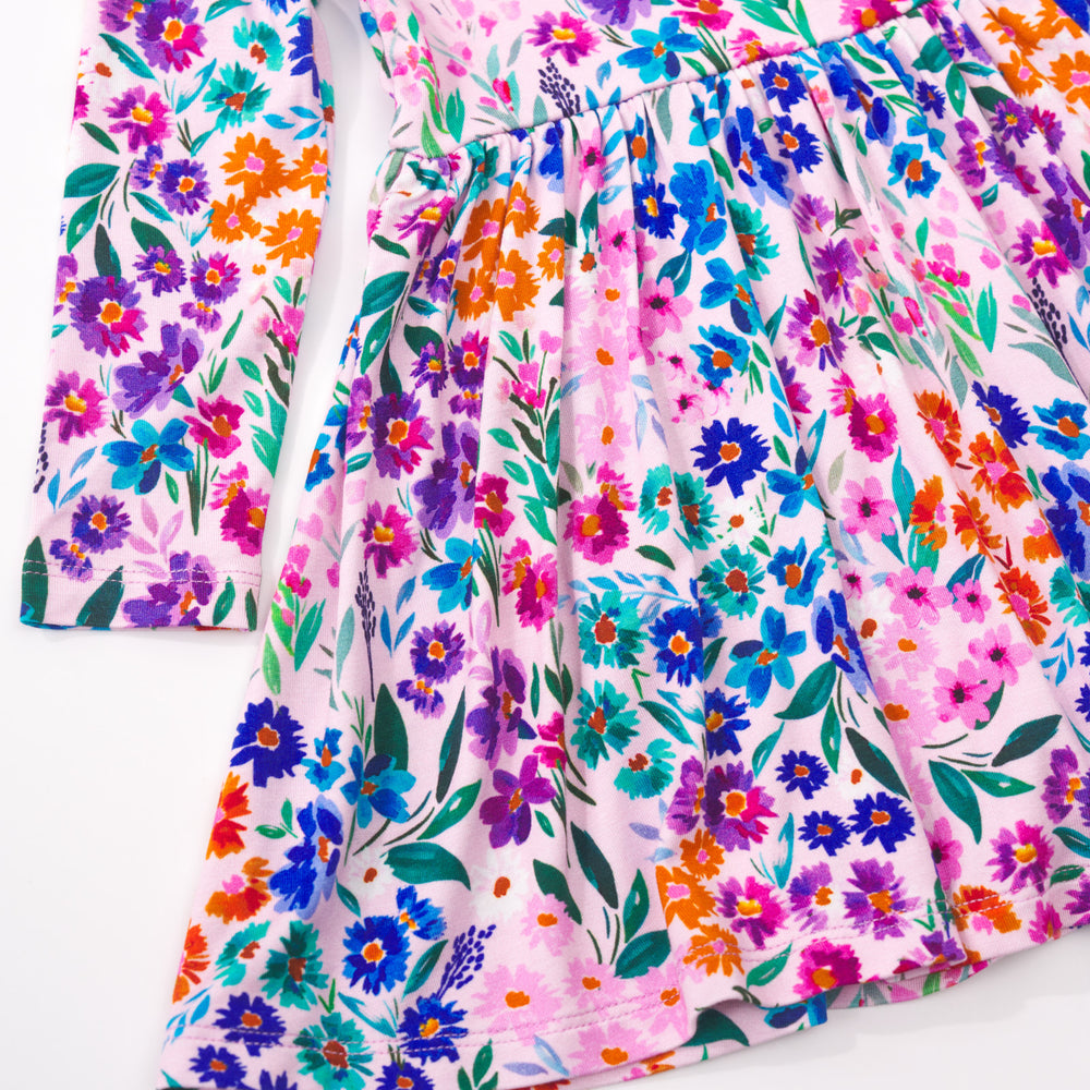 Close up detail shot of a Sweet Pea Floral Twirl Dress with Bodysuit