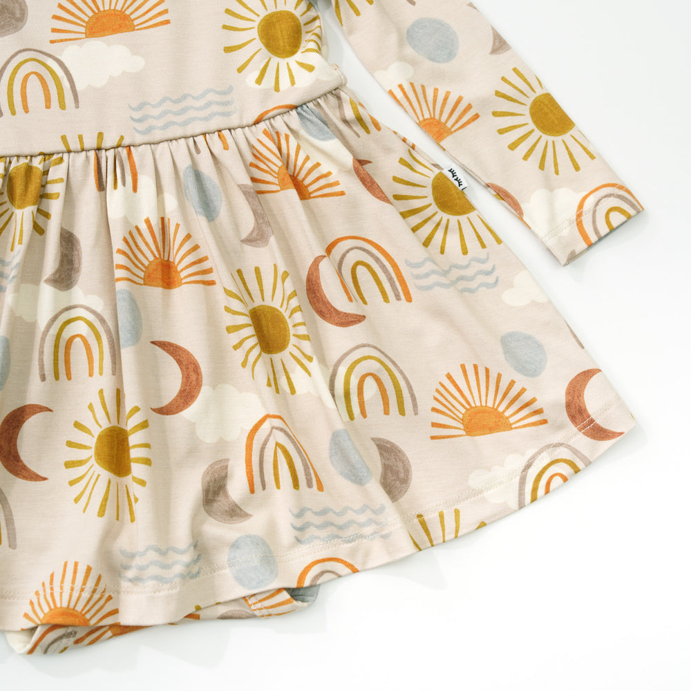 Close up detail shot of a Desert Sunrise Twirl Dress with Bodysuit