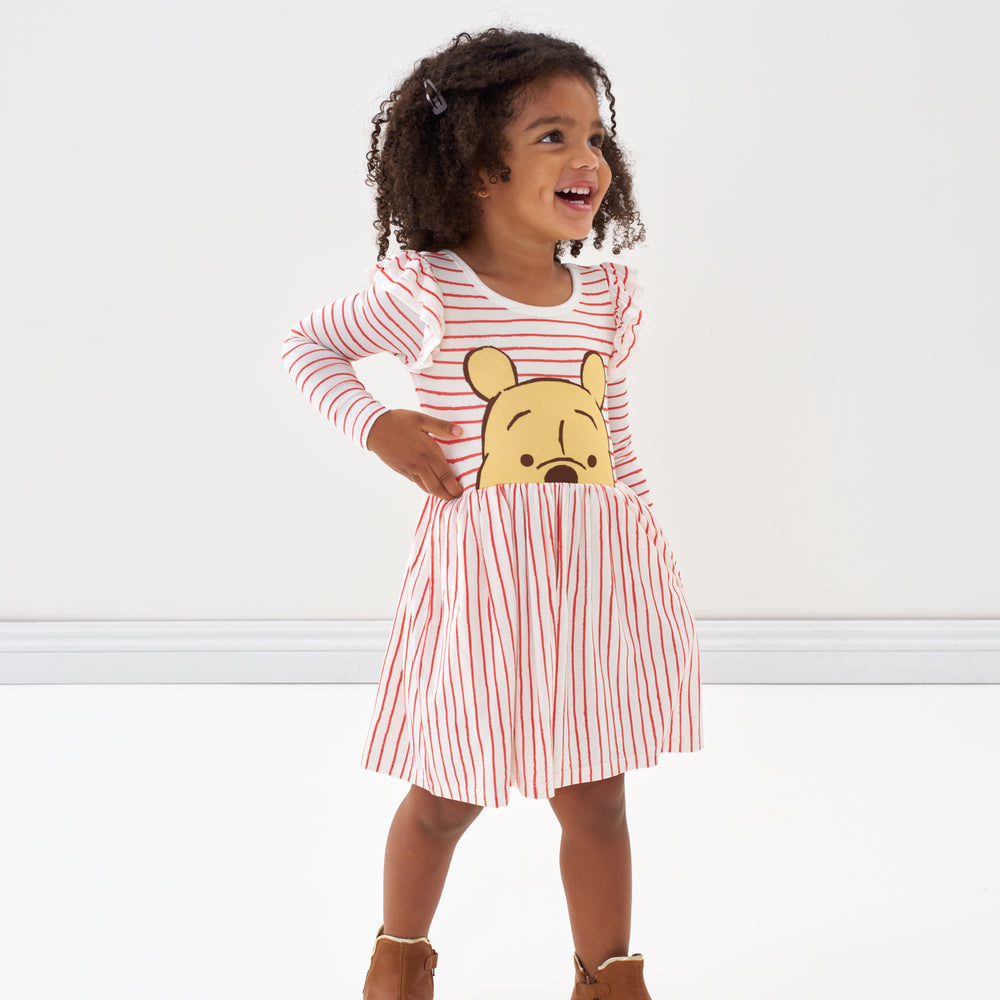 Click to see full screen - Child wearing a Disney Winnie the Pooh flutter skater dress